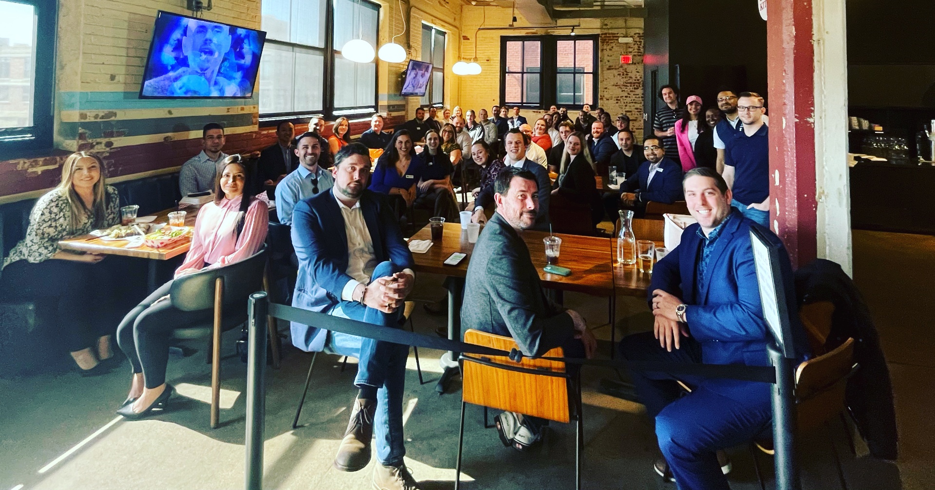 OKCYP members listening to a speaker at a venue