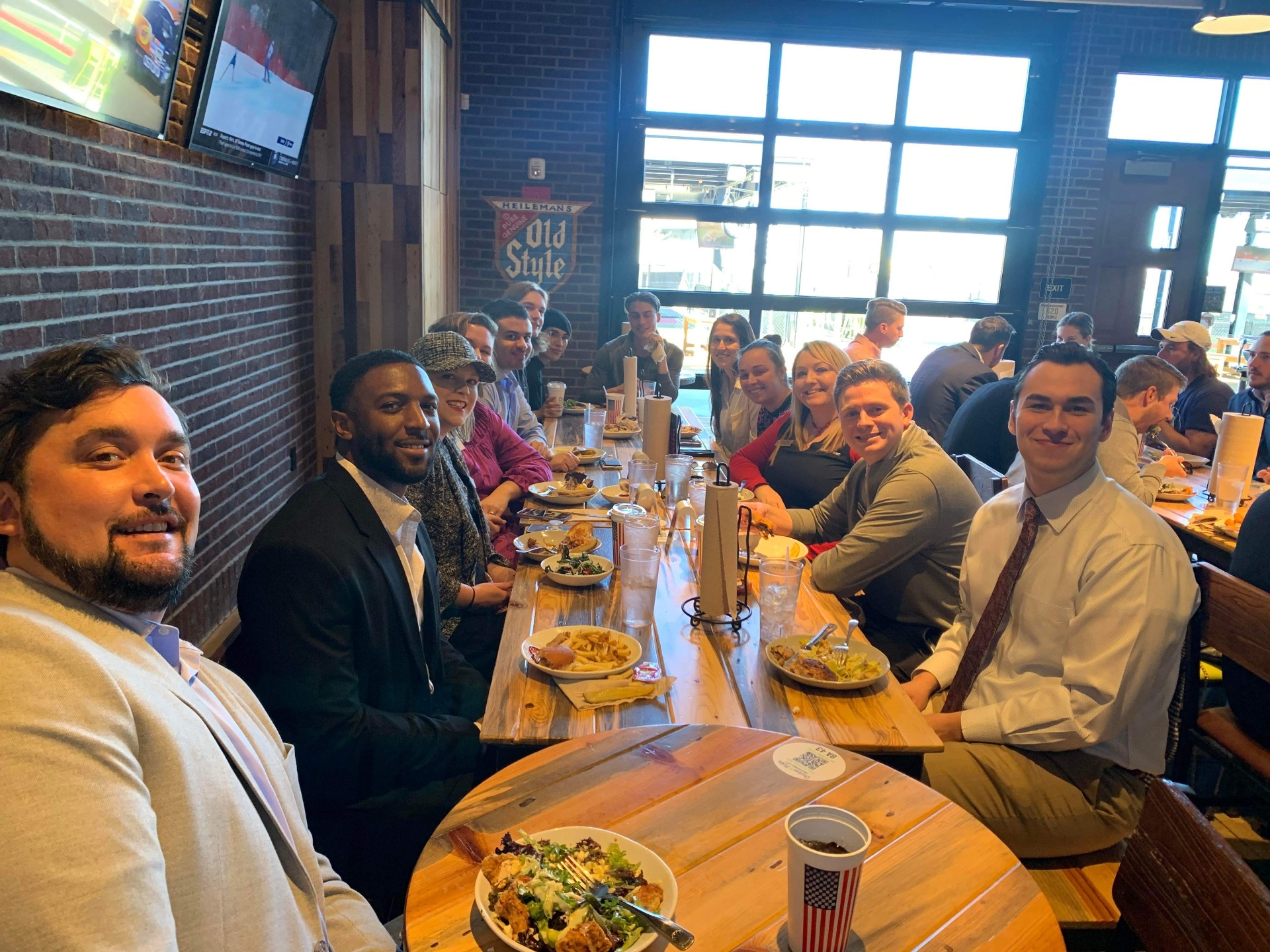 OKCYP members gathered around a table at an event