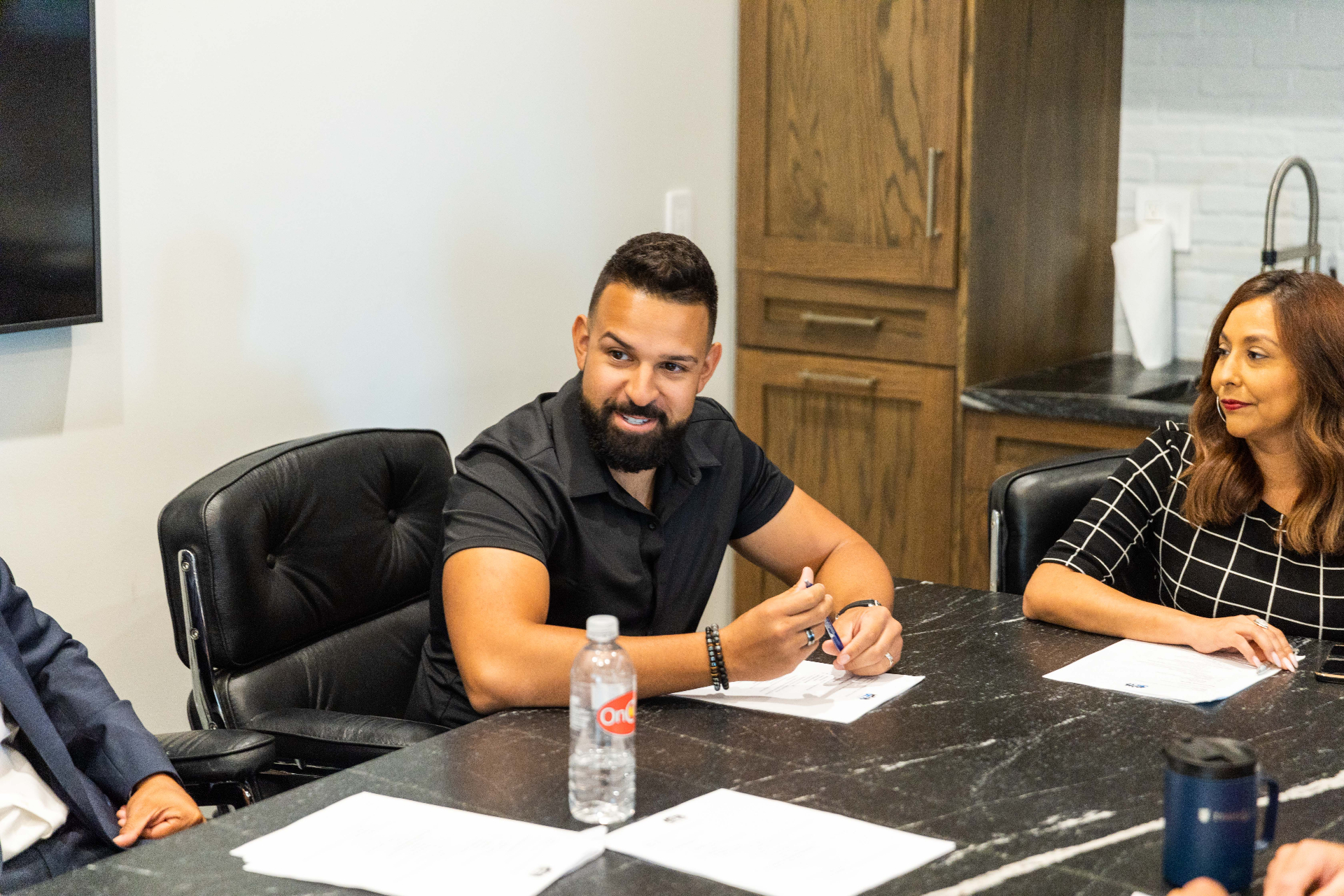 OKCYP members and partners discussing sponsorship around a table